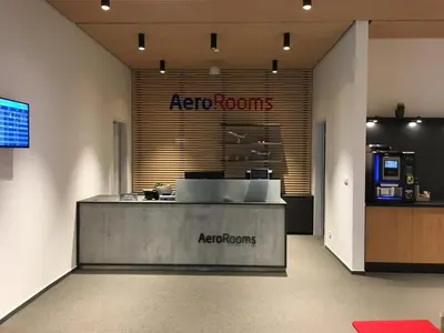 a reception area of a store with a reception counter at AeroRooms in Prague