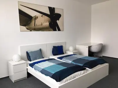 a bedroom with a large bed with a propellor at AeroRooms in Prague
