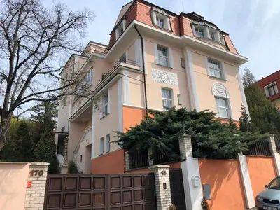 a large house with a fence in front of it at Rooms in Prague-BIG+Comfy in Prague