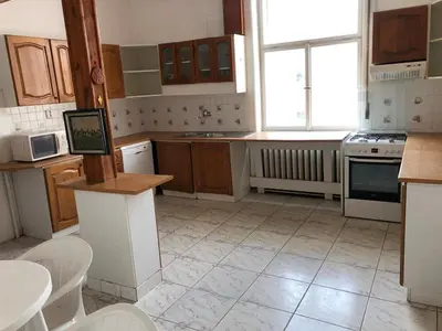 a kitchen with a stove and a window in it at Rooms in Prague-BIG+Comfy in Prague