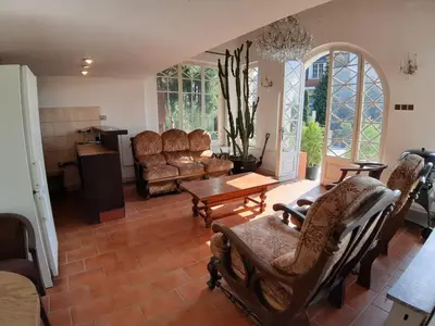 a living room with a couch and chairs and a table at Rooms in Prague-BIG+Comfy in Prague