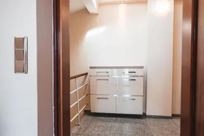 a kitchen with a refrigerator in a room at POINT flat, beautiful view from terrace to Prague Castle in Prague