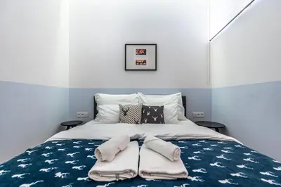 a bedroom with a bed with towels on it at Apartrezidence Opletalova in Prague
