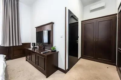 a hotel room with a vanity and a mirror at Apartrezidence Opletalova in Prague