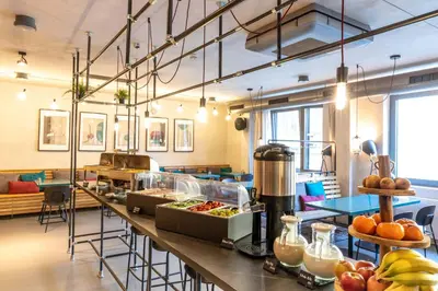 a cafeteria with a counter with food on it at Miss Sophie's Downtown in Prague