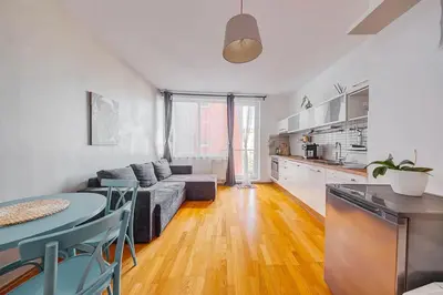 a living room with a couch and a table at Apartment Tereza in Prague