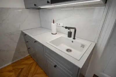a bathroom with a sink with a candle on it at Downtown Residence in Prague