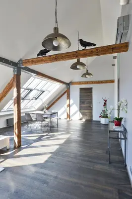 a large room with tables and chairs in a building at Designer Loft in Prague
