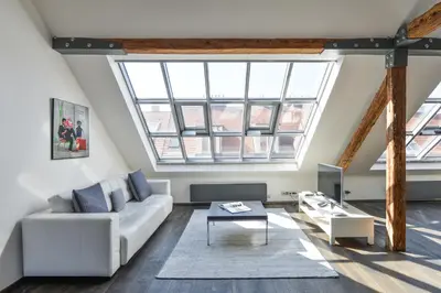 a living room with a couch and a table at Designer Loft in Prague