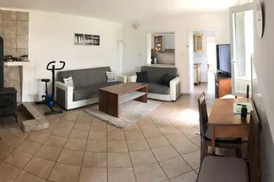 a living room with a couch and a table at Adela´s Czech Village House in Všejany
