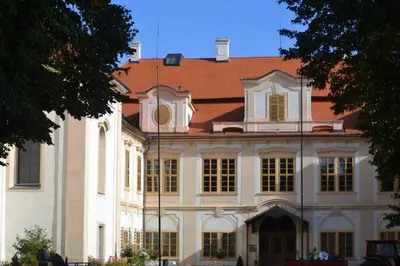 a large white building with a red roof at Adela´s Czech Village House in Všejany