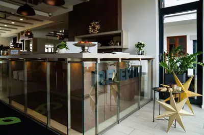 a kitchen with a large island in a room at Hotel Grunt in Mladá Boleslav