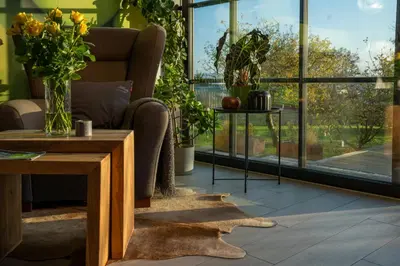 a living room with a couch and a table at Hotel Grunt in Mladá Boleslav