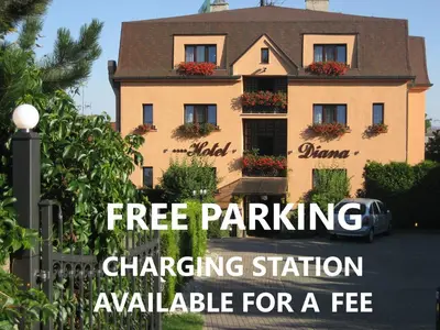 a house with the words free parking charging station available for a fee at HOTEL DIANA apartments in Prague