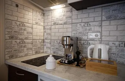 a kitchen counter with a coffeemaker and a coffee maker at Snajder Apartment, 15min to Old Centre, Self-check in, Free Wifi in Prague