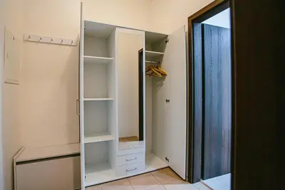 an empty closet with a mirror and a door at Snajder Apartment, 15min to Old Centre, Self-check in, Free Wifi in Prague