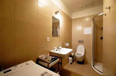 a bathroom with a sink and a toilet and a shower at Snajder Apartment, 15min to Old Centre, Self-check in, Free Wifi in Prague
