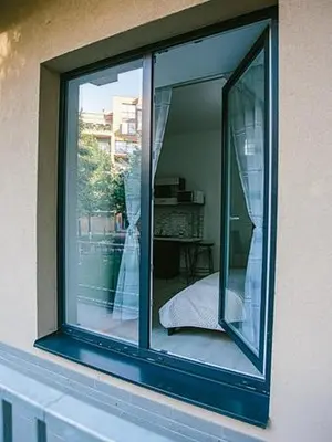 a window on the side of a building at Snajder Apartment, 15min to Old Centre, Self-check in, Free Wifi in Prague