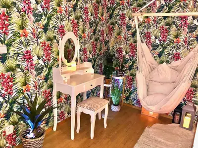 a room with a chair a mirror and a swing at Duplex with quite terrace on Wenceslas sq. in Prague