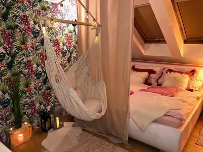 a swinging bed with a teddy bear in a hammock at Duplex with quite terrace on Wenceslas sq. in Prague