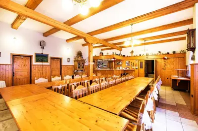 a large conference room with wooden tables and chairs at Pension U Dvou čápů in Chocerady