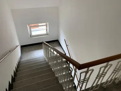 a staircase in a white building with a window at Residence Sarka in Prague