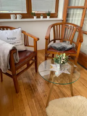 a living room with two chairs and a glass table at Residence Sarka in Prague