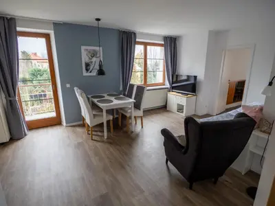 a living room with a table and chairs at Residence Sarka in Prague