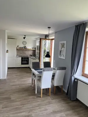 a kitchen and dining room with a table and chairs at Residence Sarka in Prague