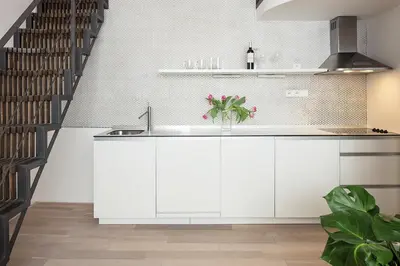 a living room with a couch and a table at Holečkova Apartments in Prague
