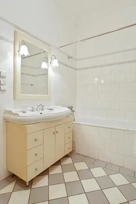 a white bathroom with a sink and a tub at Open Gate in Prague