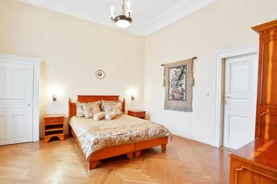 a bedroom with a bed with two teddy bears on it at Open Gate in Prague