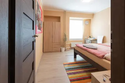 a small bedroom with a bed and a window at Cozy room at metro station, private bathroom, 9minutes oldtown, 15minutes airport, WiFi in Prague