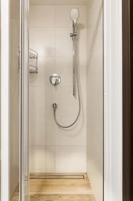 a shower with a shower head in a bathroom at Cozy room at metro station, private bathroom, 9minutes oldtown, 15minutes airport, WiFi in Prague