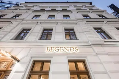 a building with a sign on the front of it at Áurea Legends by Eurostars Hotel Company in Prague
