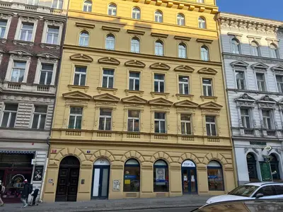 a large yellow building with a lot of windows at Apartment COLOURS - your 7 colour experience in centre of Prague in Prague