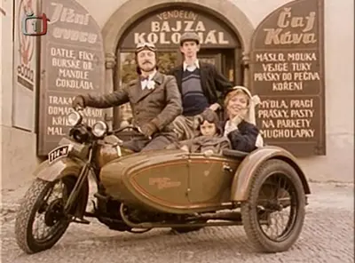 an old photo of a family sitting in a side car at Apartmány č.p. 9 in Kouřim