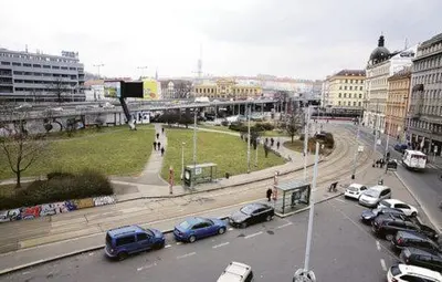 a busy city street with cars parked on the street at Apartmán VAN NG in Prague