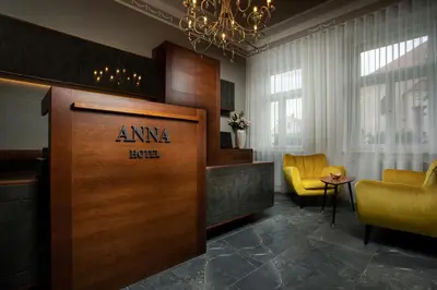 a lobby with a hotel sign on a wooden door at Hotel Anna in Beroun