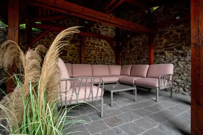 a couch and two chairs on a patio at Hotel Anna in Beroun