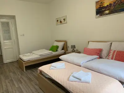 a living room with two beds and a couch at KK Apartments in Prague