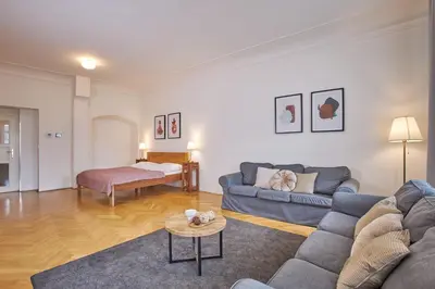 a living room with a couch and a table at Charles Bridge Apartments in Prague