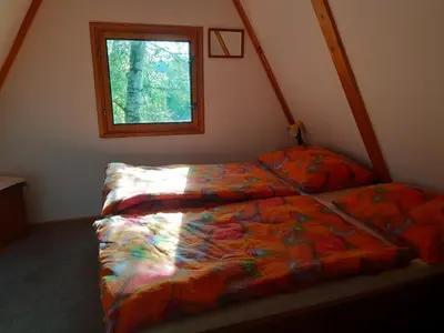a bedroom with a bed and a window at Holiday home Zajícovi in Rabyně