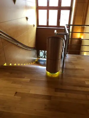 a set of stairs with a trash can on the floor at Huge luxury central Prague VILLA, 6 beds and baths, terraces, double garage in Prague