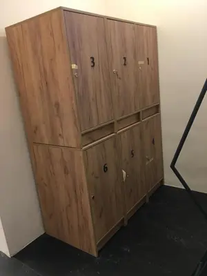 a group of wooden cabinets in a room at Capsule Hostel Top Wenceslas square in Prague
