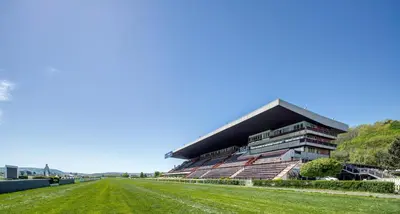 a stadium with a grass field in front of it at B&B Chuchle Arena Praha in Prague