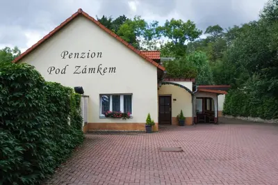 a white building with the words pension rod zermim at Penzion Pod Zámkem in Pruhonice