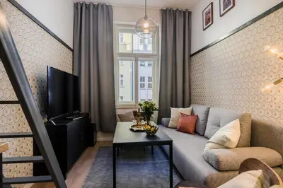 a living room with a couch and a table at Royal Apartments Prague by Michal&Friends in Prague