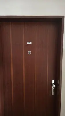a wooden door with a sign on it at Apartmán Mírová 472 B in Milovice