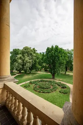 a view of a garden from the balcony of a building at Vila Lanna in Prague